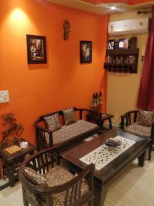 a living room with a table and chairs at Deer park Studio Flat (1 BHK) in New Delhi
