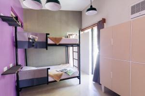 Postel nebo postele na pokoji v ubytování Spin Designer Hostel - El Nido