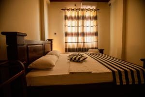 Postel nebo postele na pokoji v ubytování Evergreen Hotel Dambulla