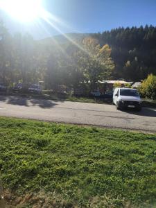 a white van parked on the side of a road at Chalets D Or - 2 Pièces pour 4 Personnes 164 in Vénosc