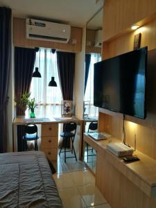 TV a/nebo společenská místnost v ubytování Studio Pleasant Tifolia