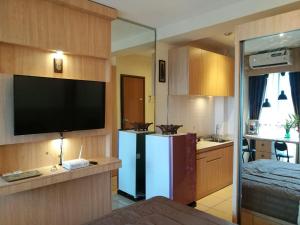TV a/nebo společenská místnost v ubytování Studio Pleasant Tifolia