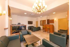 a living room with a couch and chairs and a table at Bazaar Hotels Old City in Istanbul