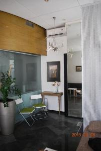 a living room with two chairs and a table at Apartment Center 25 in Ljubljana