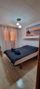 a bedroom with a large bed in a room at Haus Mapetilo in Guardamar del Segura