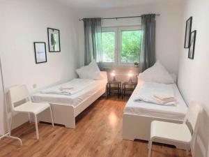 Säng eller sängar i ett rum på DWK: Monteurhaus Bad Ems