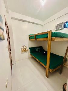 Postel nebo postele na pokoji v ubytování Siargao Zita's Garden Inn