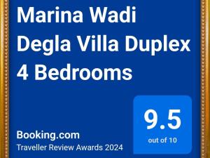 a sign that reads marina waikiki villa duplex bathrooms at Marina Wadi Degla Villa Duplex 4 Bedrooms in Ain Sokhna