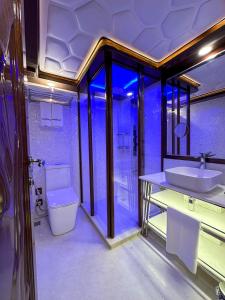 a bathroom with a sink and a toilet at Overnight Super Yacht - Orchid in Dubai