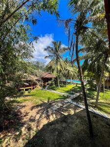 a view of a resort with palm trees at Goyambokka Beach Retreat in Tangalle +154 photos