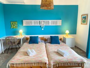 A bed or beds in a room at The Beachhouse Apartments