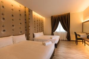 Letto o letti in una camera di D Elegance Hotel Nusajaya