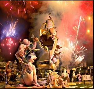 a group of figurines on a display with fireworks at APARTAMENTO CONSTITUCIÓN in Benicarló