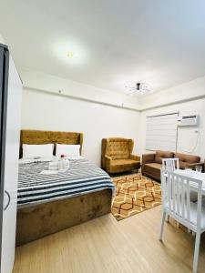 Ένα ή περισσότερα κρεβάτια σε δωμάτιο στο Starlight Suites