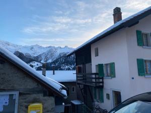 a view of a snowy mountain from a building at Chalet del Sole in Quinto