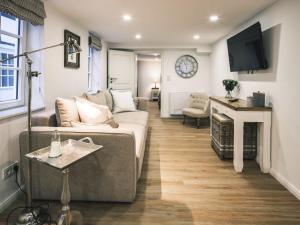 a living room with a couch and a fireplace at Flecker Hotel in Freudenberg