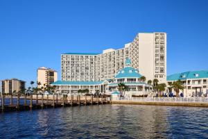 a view of a resort from the water with buildings at Marriott Sanibel Harbour Resort & Spa in Fort Myers