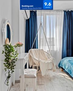 a swing in a bedroom with a desk at Cozy Special City Center - Old Town Apartment with terrace in Bucharest