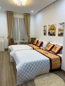 Postel nebo postele na pokoji v ubytování Nhà Nghỉ Huyền Anh