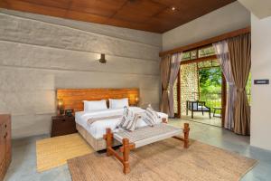 Letto o letti in una camera di Sanctuary Chitwan National Park