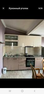 A kitchen or kitchenette at My home 1