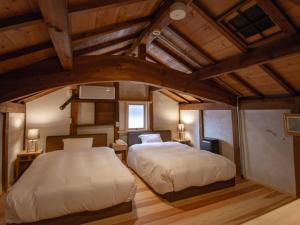 Lova arba lovos apgyvendinimo įstaigoje NIPPONIA HOTEL 伊賀上野 城下町
