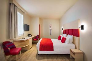 Un ou plusieurs lits dans un hébergement de l'établissement Best Western Plus Hôtel Escapade Senlis