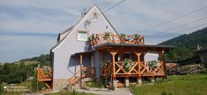 a house with a wrap around porch at Sowi Dom - Jugów in Jugów