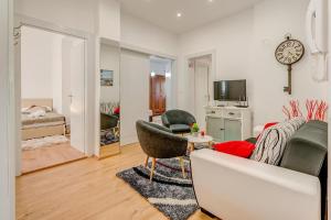 a living room with a couch and chairs and a television at Happy Home - Rental Residence in Split