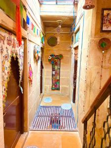 an empty hallway with a staircase in a room at Little Prince Home Stay in Jaisalmer