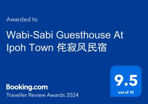 um sinal azul com as palavras wadi saladin guesthouse atoren towneng em Wabi-Sabi Guesthouse At Ipoh Town 侘寂风民宿 em Ipoh