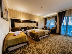 Postel nebo postele na pokoji v ubytování Elegance Resort Hotel & SPA Wellness-Aqua