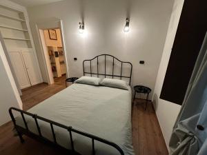 Ένα ή περισσότερα κρεβάτια σε δωμάτιο στο Casa di Oscar