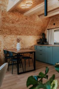 a kitchen and dining room with a table and chairs at SkyGlamp in Ustroń