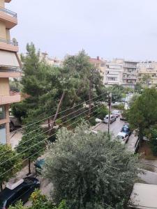 an overhead view of a city with cars parked in a parking lot at Independent and newly built apartment in Kallithea, next to Tavros train station, in a nice neighborhood in Athens