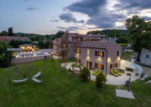 an aerial view of a house with a yard at Villa Vesna with tennis court in Pićan