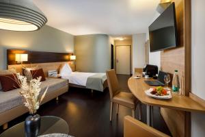 Katil atau katil-katil dalam bilik di Hotel Olten Swiss Quality
