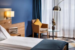 Katil atau katil-katil dalam bilik di Hotel Olten Swiss Quality