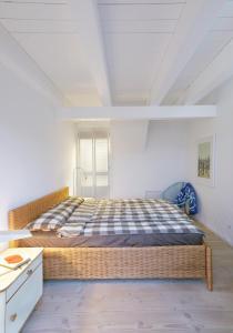 Ένα ή περισσότερα κρεβάτια σε δωμάτιο στο Witt Hus nahe der Ostsee - Ihr perfektes Feriendomizil in Barth