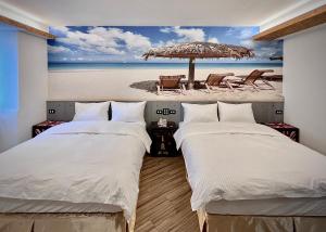 A bed or beds in a room at Good Time Boutique Hotel