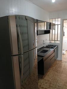 Kuchyň nebo kuchyňský kout v ubytování Quarto próximo ao shopping Moinhos