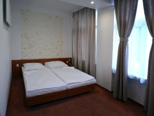 Posteľ alebo postele v izbe v ubytovaní Penzion Hacienda Ranchero