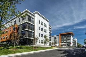 a white building on the side of a street at Burlington 1br w gym wd nr dining shops BOS-978 in Burlington