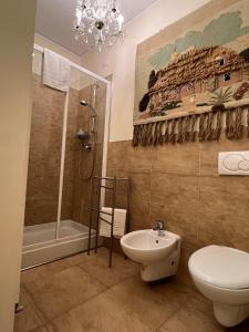 a bathroom with a toilet and a shower and a sink at CasaBella in Venice +24 photos