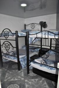 a group of four bunk beds in a room at Casa ricardo balcazar in Cali