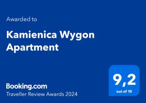 ein blaues Rechteck mit den Worten Kaminantha wyncorens App in der Unterkunft Kamienica Wygon Apartment in Danzig