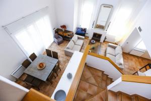 an overhead view of a living room and dining room at New Aiguesverdes ONLY FAMILIES in Reus