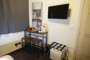 TV a/nebo společenská místnost v ubytování Civico 69 Luxury room
