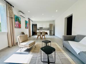 a living room with a couch and a table at Villa Saint Jean En Provence in Châteaurenard