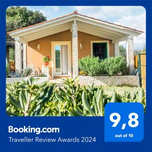 a picture of a small house with a sign that says travel review awards at Villa Aelia - A Peaceful And Private Place in Argostoli